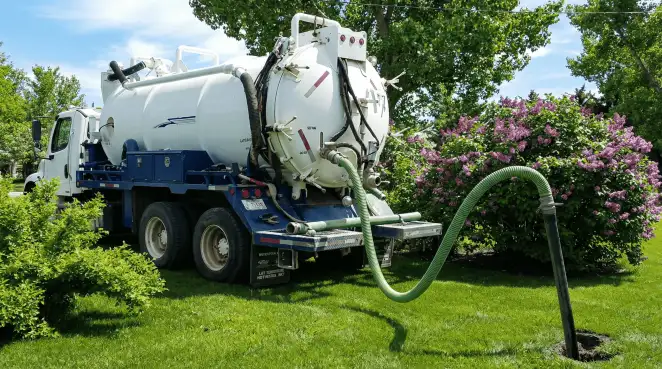 Professional vacuum truck performing residential drainage and septic maintenance in Fort Worth, TX