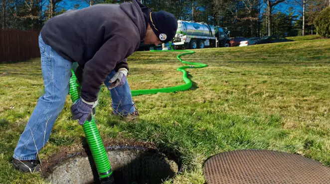 Service technician performing residential septic pumping and drainage maintenance in Fort Worth, TX